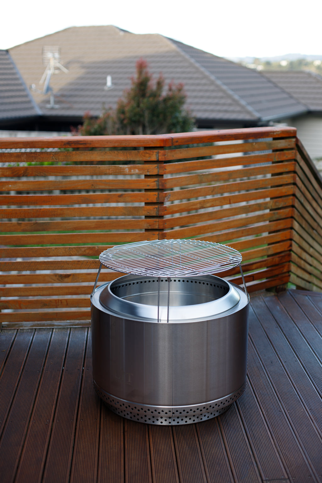 Stainless steel fire pit with grill