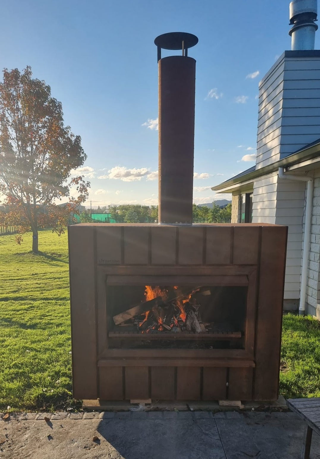 Big Brute Corten steel outdoor fireplace with fire